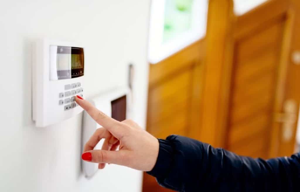 Alarm System Keypad Entering Security Code on Home in NQ